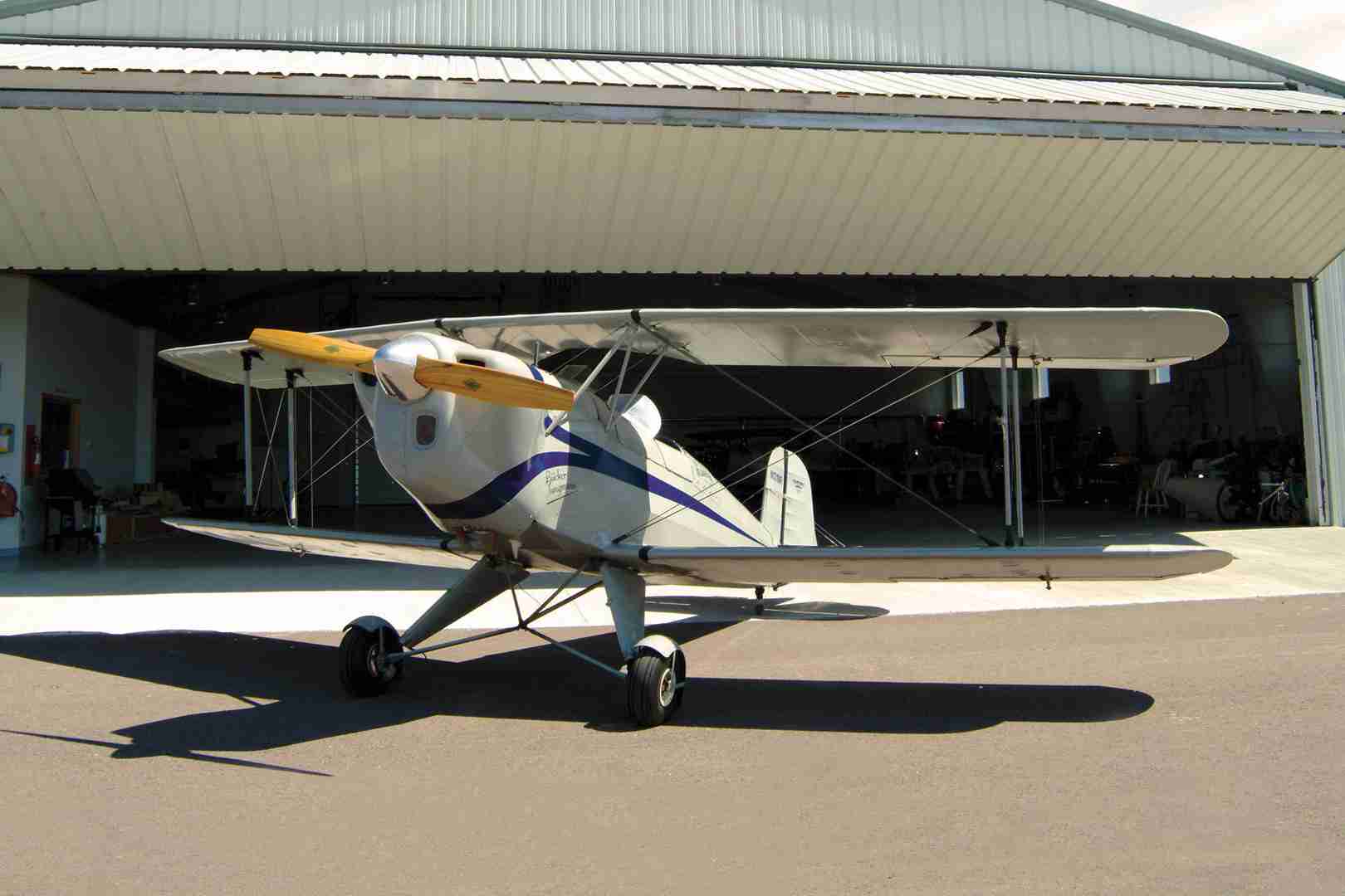 airplane in front of hangar door